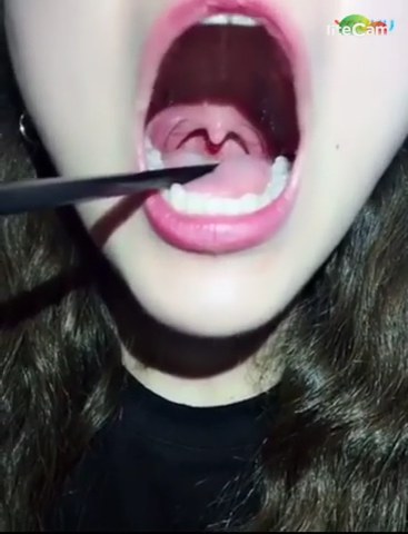 chinese girl uvula (was she swallowing with her open mouth at 0:56?) movie  from JizzBunker.com video site
