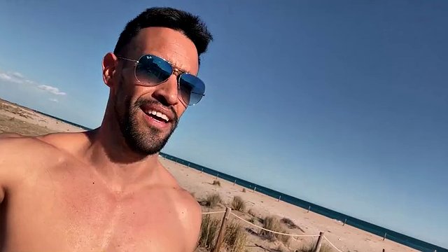 Naked sexy latin man on a public beach