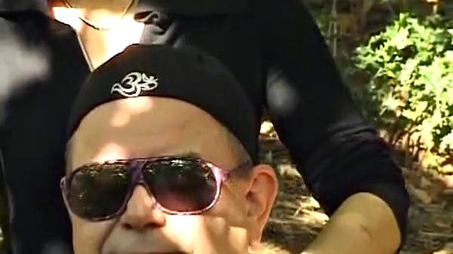A mature German domina spanks her man in the woods