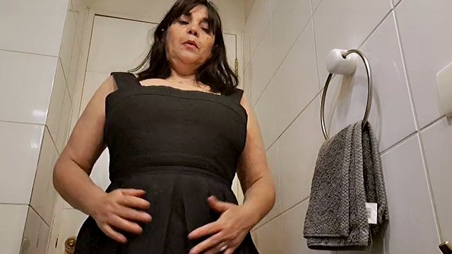 Sexy stepmom masturbates in the bathroom