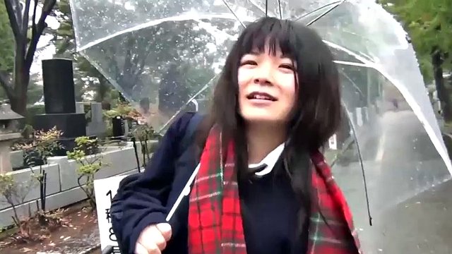 Cute Japanese girl pleases with a vibrator in the rain