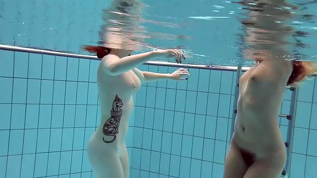 naughty katrin and lucy swim naked in a swimming pool