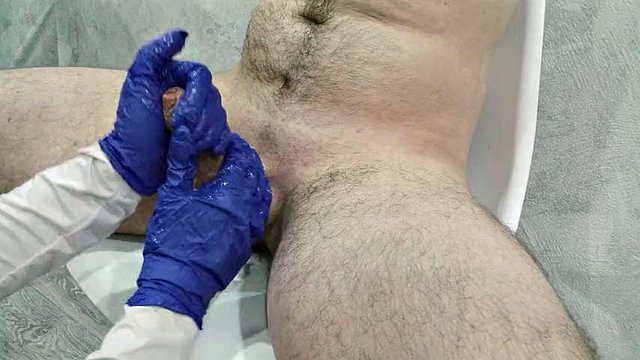 The nurse thoroughly massaged the patient's testicles and penis to collect sperm for analysis