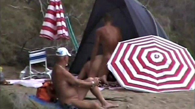 Horny nudist couple on the beach all go out