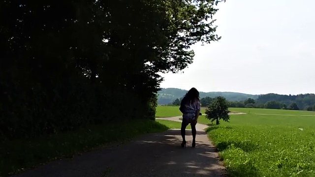 Cross dressing gay slut toys his anus neat the forest