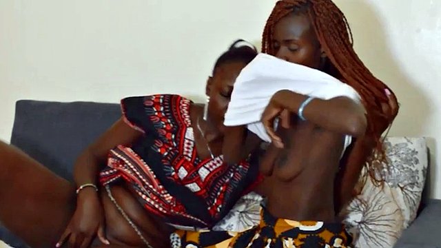 Hot black African girls discover the taste of pussy and share a dildo in their first lesbian kiss