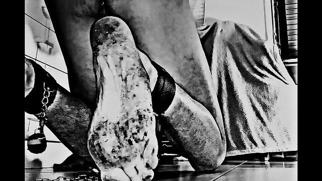 A real BDSM slave cleans the floor, shackled by his buttocks, on the orders of his cruel Mistress. video Slave-K001