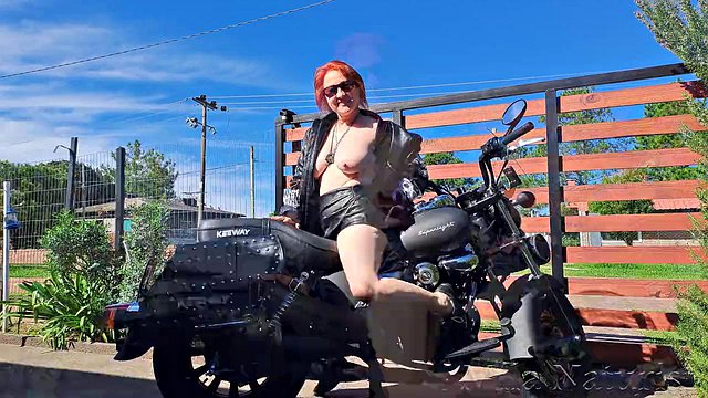 Mila Naturist Flaunts Big Tits in Skimpy Leather Outfit on Black Bike Behind the Scenes Tease