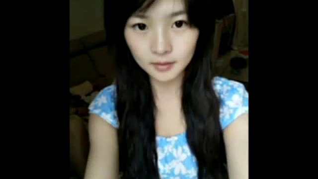 cute chinese girl playing on webcam