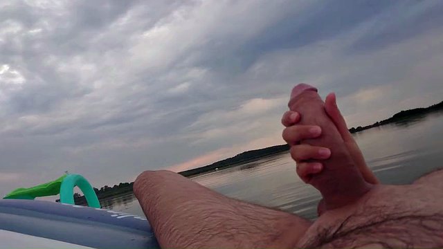 My wife jerks off my dick with a happy ending in the inflatable boat on the lake
