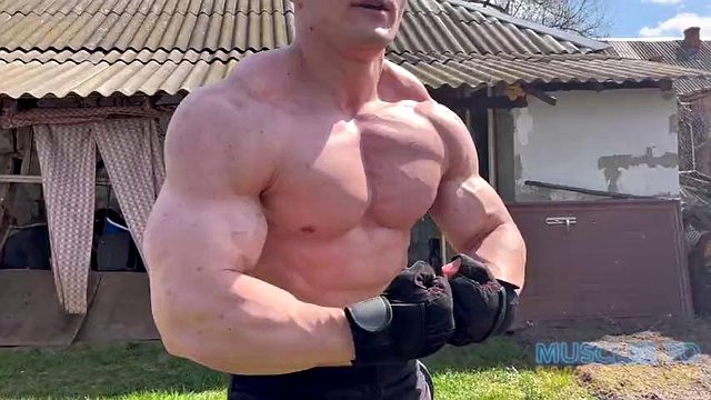 Roided Muscle Bodybuilder Pumps Up in Backyard