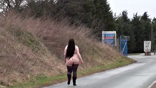 Ugly fat slut walking naked on a public road