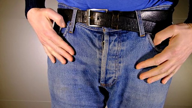 Close the band on the boxer shorts, then show the flaccid and uncut penis and foreskin.