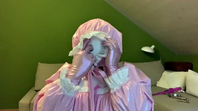 Sissy in diaper with bondage hood