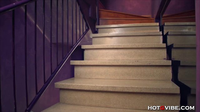 busty babe sitting on the stairs playing with her pussy
